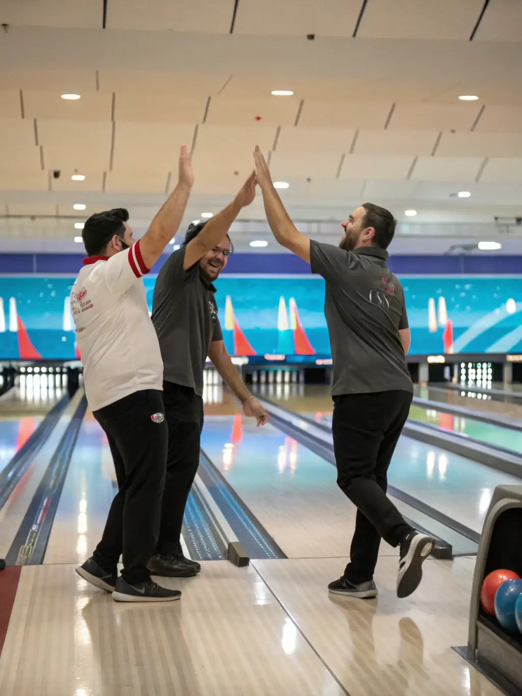A photo capturing the excitement of a competitive bowling tournament, with bowlers focused and determined to win.